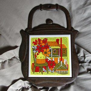 vintage 1960s cast iron ceramic tile trivet